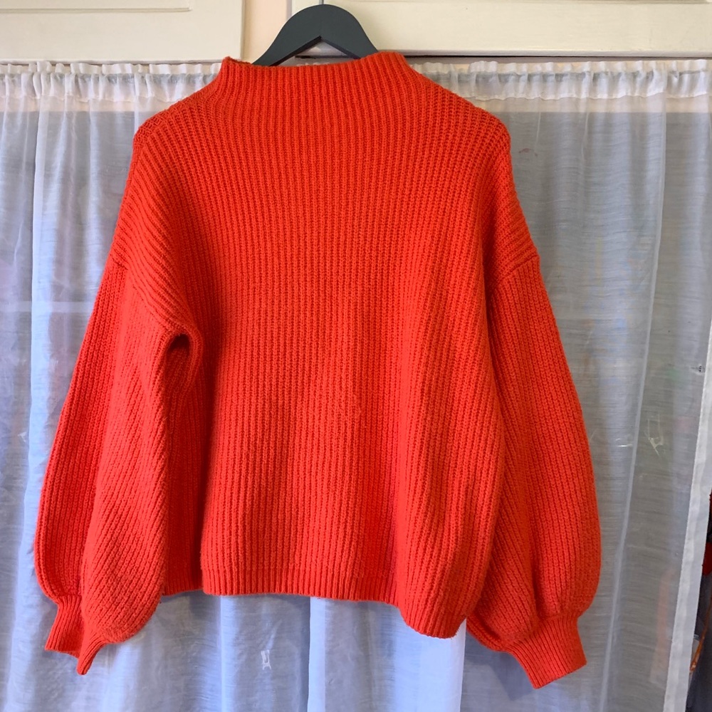 Orange long bell sleeved turtleneck top